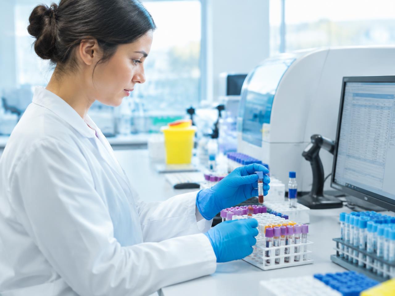 Laboratory technician handling blood samples